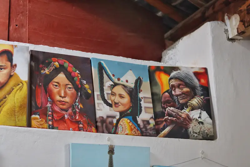 A Tibetan painting featuring four portraits of Tibetan people.