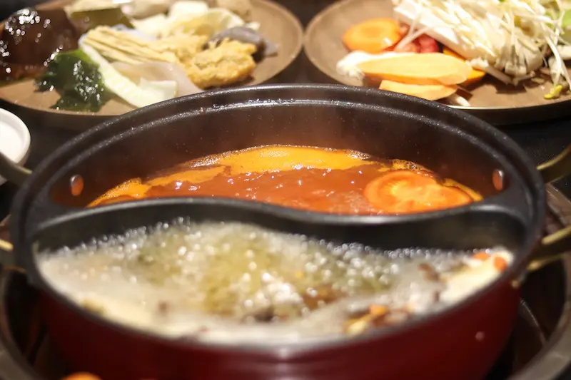 A yin-yang style wild mushroom hotpot.