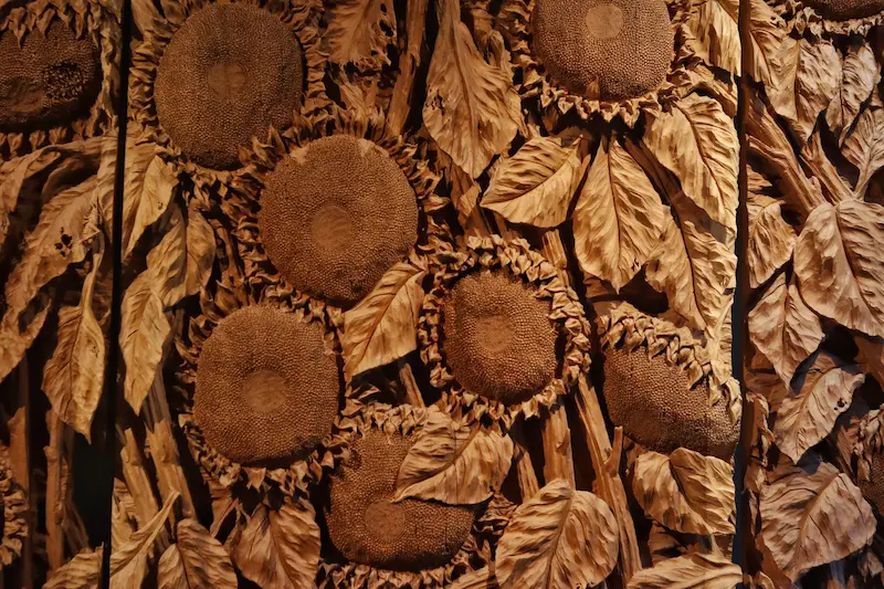 Delicate wooden sunflower carvings in Dali.