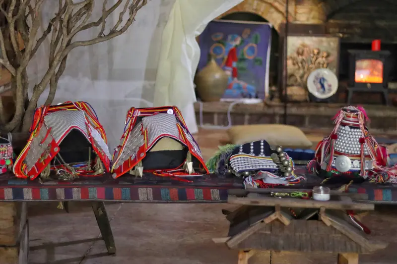 Traditional costumes and home interior in an Aini (Hani) village