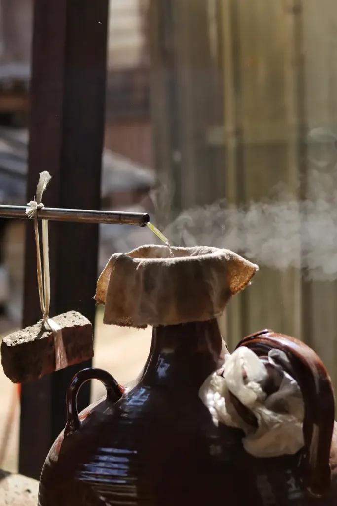 Home-style rice alcohol being made in a Jingmai Mountain village