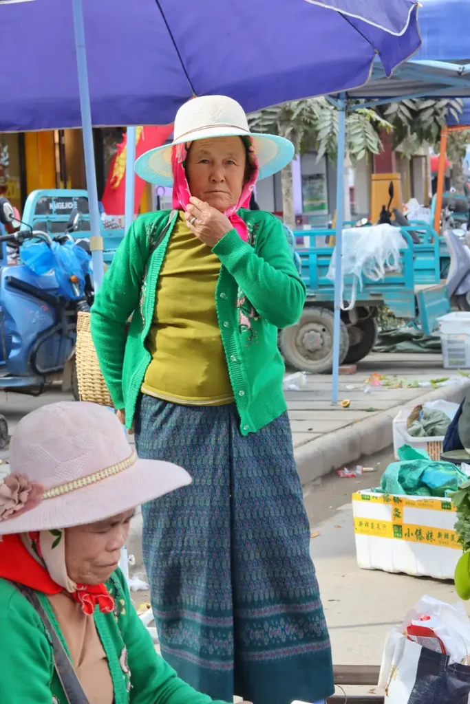 Women in traditional dress at an ethnic market near Menghai, Xishuangbanna
