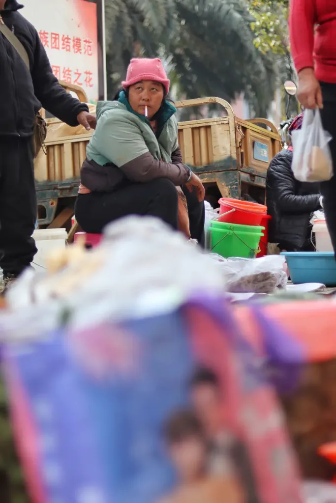Vendor at a local market in Menglian, southwest Pu'er