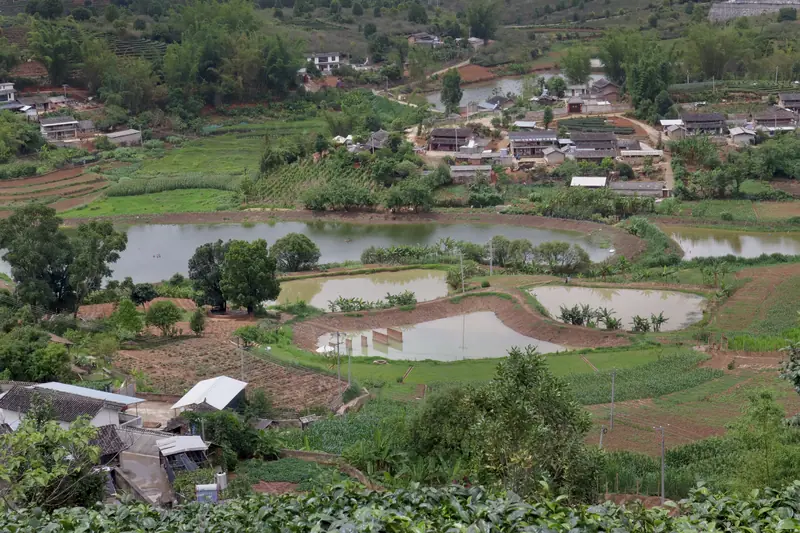 View over farmland and a village in the Ning'er valley, Pu'er