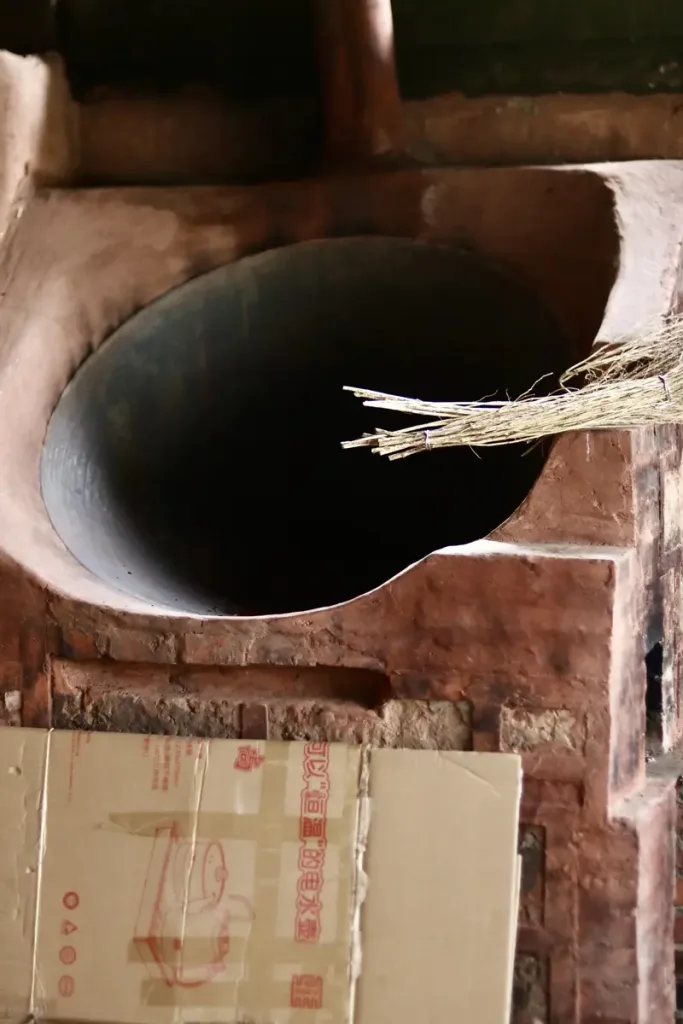 Traditional wok for roasting tea at a tea village on an ancient tea mountain