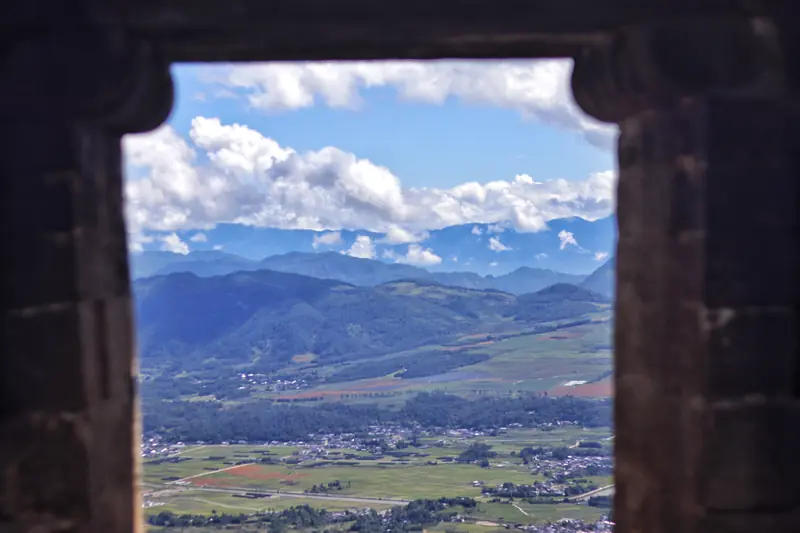 View over a tranquil ancient village set in a green valley near Tengchong