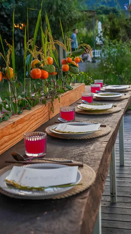 Candlelit farm-to-table dinner setting outdoors in Yunnan