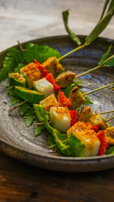 Vegetable skewer course plated with citrus, Yunnan farm-to-table dinner