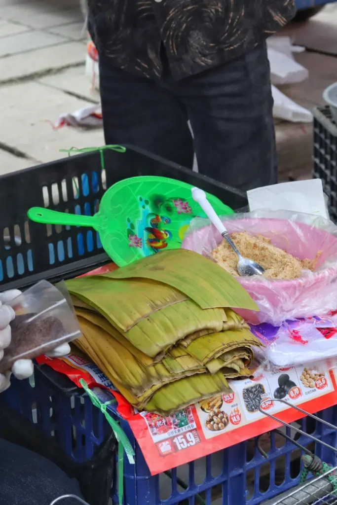 Stall of fresh produce and goods at an ethnic market near Menghai.