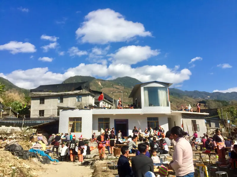 Villagers gather at a house warming party at a village in Yunnan.