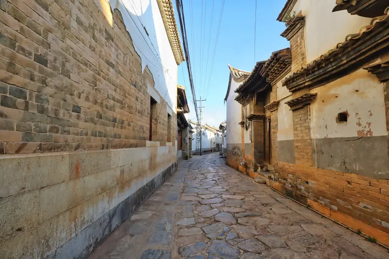 A quiet stone lane through Shiping's 600-year-old village.