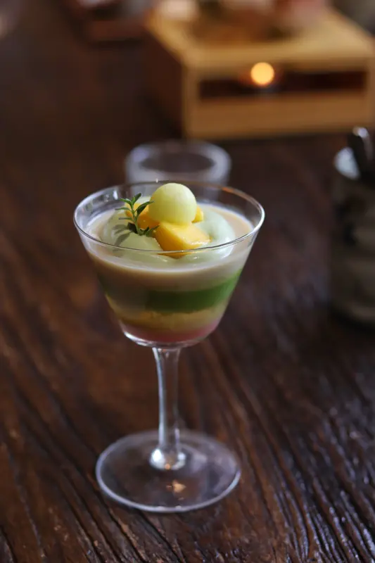 Layered vegan dessert served in a glass, Yunnan fine dining course