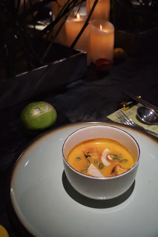 Vegan soup course served by candlelight, Yunnan fine dining