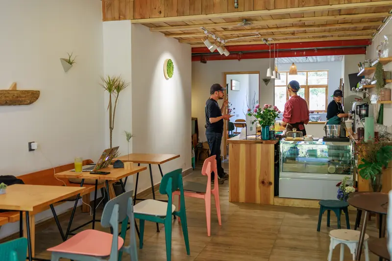 Interior of a vegan cafe with colorful seating, Yunnan