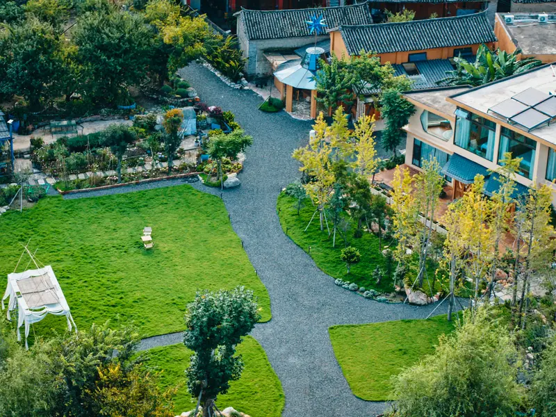 Aerial view of a vegan homestay courtyard and garden in Yunnan